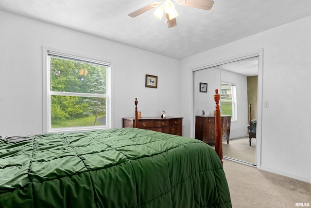 161 Lakecrest Pl, Dahinda, IL 61488 - bedroom featuring light colored carpet, multiple windows, a ceiling fan, and a closet