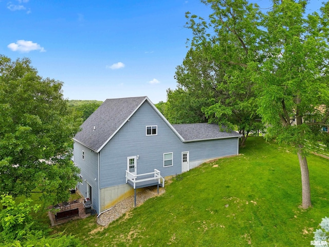 161 Lakecrest Pl, Dahinda, IL 61488 - view of property exterior featuring roof with shingles and a yard