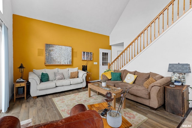 161 Lakecrest Pl, Dahinda, IL 61488 - living area featuring high vaulted ceiling, stairs, and wood finished floors