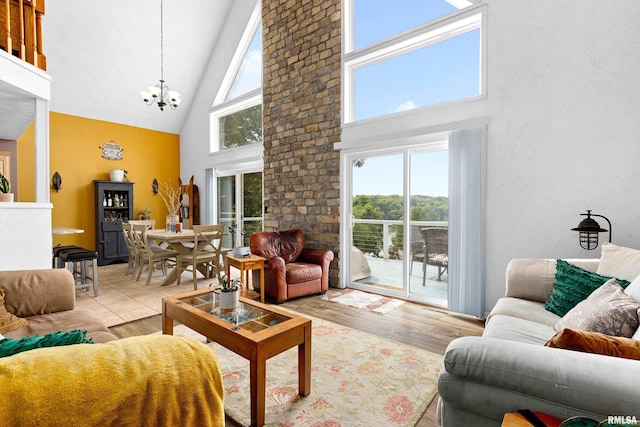 161 Lakecrest Pl, Dahinda, IL 61488 - living room featuring high vaulted ceiling, a chandelier, and wood finished floors
