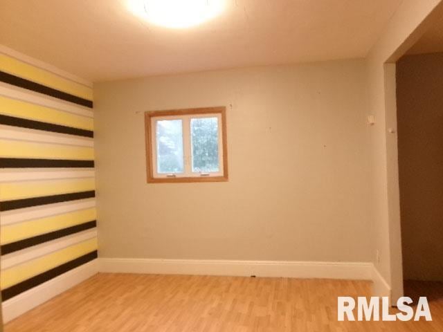 335 W Walnut St, Washburn, IL 61570 - spare room with light wood-style floors and baseboards