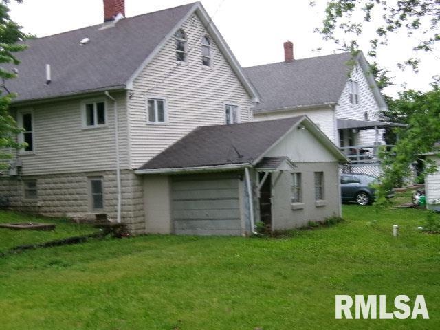 335 W Walnut St, Washburn, IL 61570 - back of house featuring a chimney, a yard, and roof with shingles