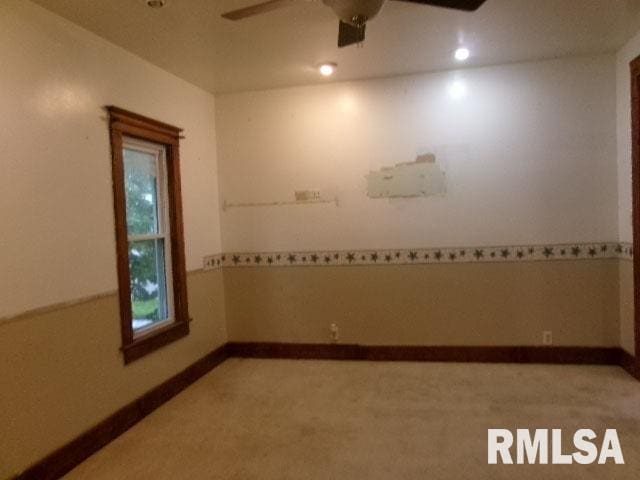 335 W Walnut St, Washburn, IL 61570 - unfurnished room with light colored carpet and ceiling fan