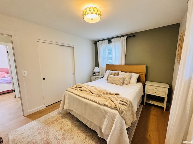 702 S Pearl St, Macomb, IL 61455 - bedroom with a closet and light wood-type flooring