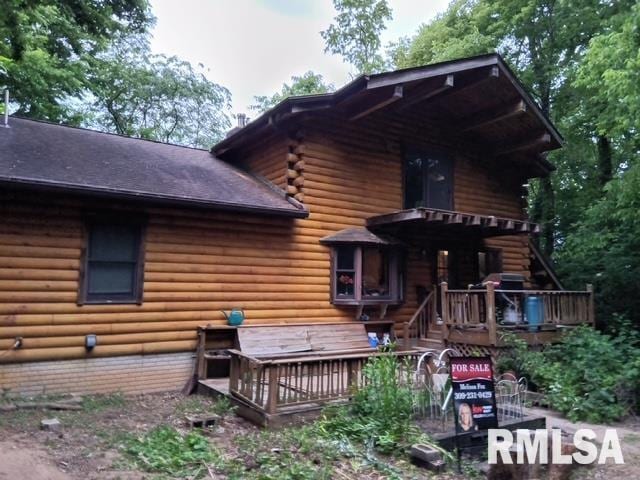 130 Zimmerman Rd, Spring Bay, IL 61611 - rear view of house featuring a deck and log exterior