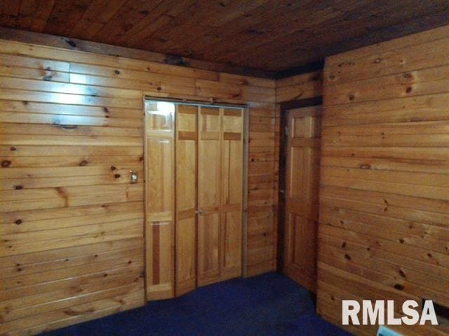 130 Zimmerman Rd, Spring Bay, IL 61611 - spare room with wood walls and wood ceiling