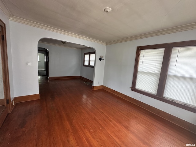 209 E Corrington Ave, Peoria, IL 61603 - spare room with arched walkways, ornamental molding, wood finished floors, and a smoke detector