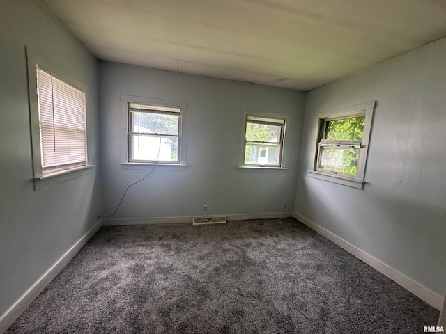 209 E Corrington Ave, Peoria, IL 61603 - carpeted spare room featuring healthy amount of natural light