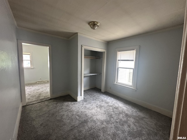 209 E Corrington Ave, Peoria, IL 61603 - unfurnished bedroom with crown molding, carpet, and a closet