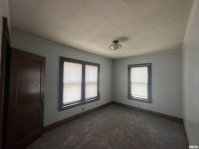 209 E Corrington Ave, Peoria, IL 61603 - unfurnished room with dark colored carpet and ornamental molding