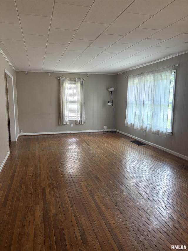 626 N Main St, Lewistown, IL 61542 - empty room with wood-type flooring and ornamental molding