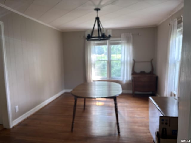 626 N Main St, Lewistown, IL 61542 - dining room with wood finished floors, crown molding, and a chandelier