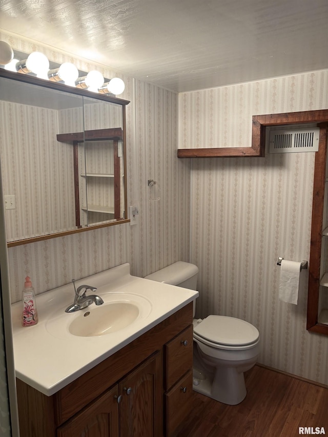 626 N Main St, Lewistown, IL 61542 - bathroom with wood finished floors and vanity