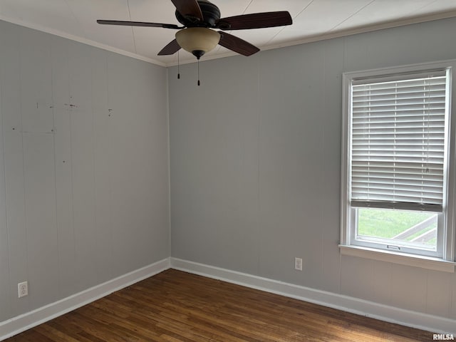 626 N Main St, Lewistown, IL 61542 - spare room featuring dark wood finished floors, crown molding, and ceiling fan