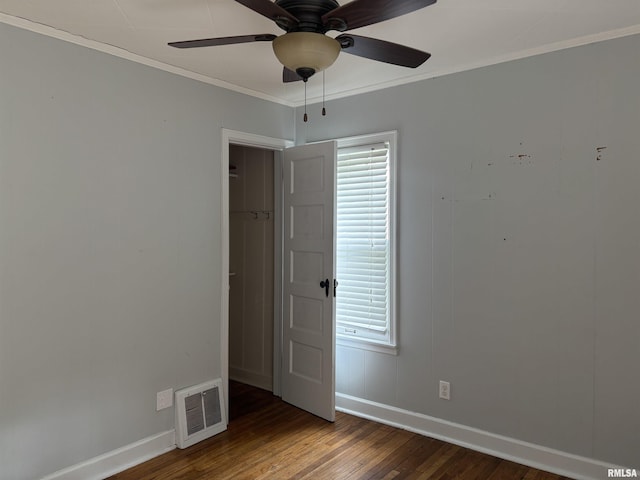 626 N Main St, Lewistown, IL 61542 - unfurnished room featuring hardwood / wood-style flooring, a ceiling fan, and ornamental molding