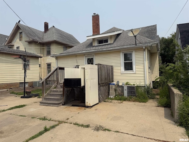 1712 W Bradley Ave, Peoria, IL 61606 - back of house featuring a chimney