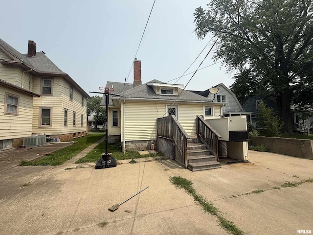 1712 W Bradley Ave, Peoria, IL 61606 - rear view of property featuring a chimney