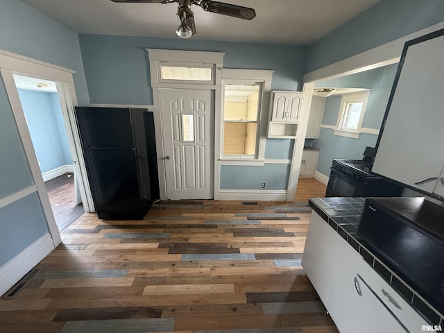 1712 W Bradley Ave, Peoria, IL 61606 - foyer featuring hardwood / wood-style floors and ceiling fan