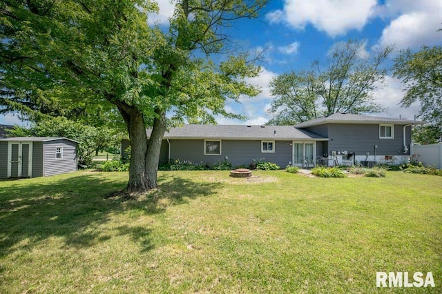 1200 Highview Rd, East Peoria, IL 61611 - rear view of property with a fire pit and a storage unit