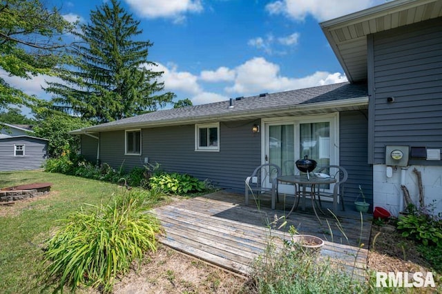 1200 Highview Rd, East Peoria, IL 61611 - back of house featuring a deck, a lawn, and roof with shingles
