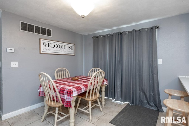 1200 Highview Rd, East Peoria, IL 61611 - dining space featuring tile patterned floors and baseboards