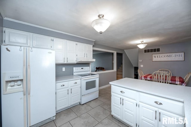 1200 Highview Rd, East Peoria, IL 61611 - kitchen featuring white appliances, light countertops, white cabinets, light tile patterned floors, and backsplash