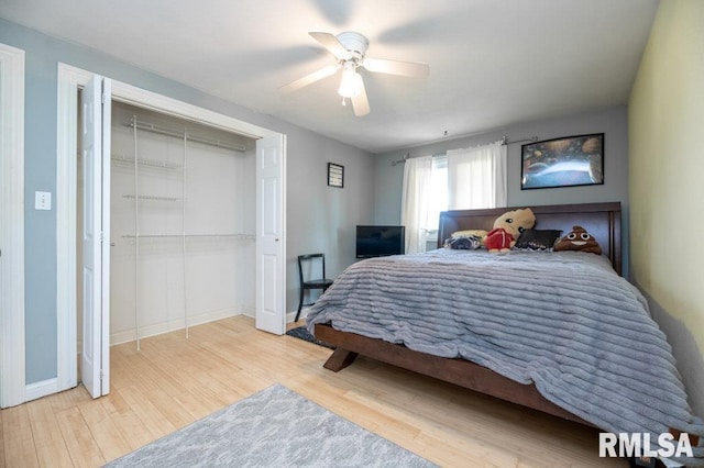 1200 Highview Rd, East Peoria, IL 61611 - bedroom with wood finished floors, ceiling fan, and a closet