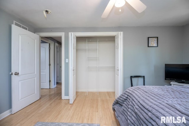 1200 Highview Rd, East Peoria, IL 61611 - bedroom with a closet, light wood-type flooring, and ceiling fan