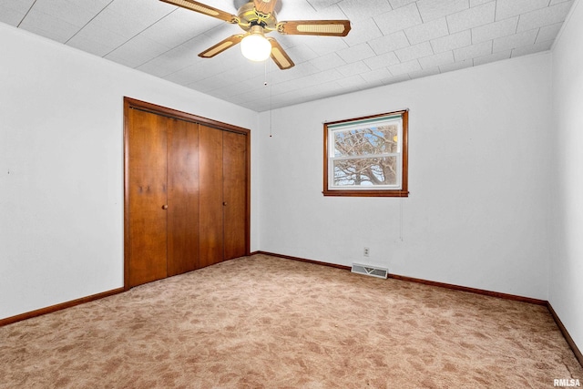 16905 E 1600th St, Bushnell, IL 61422 - unfurnished bedroom with carpet, a closet, and ceiling fan