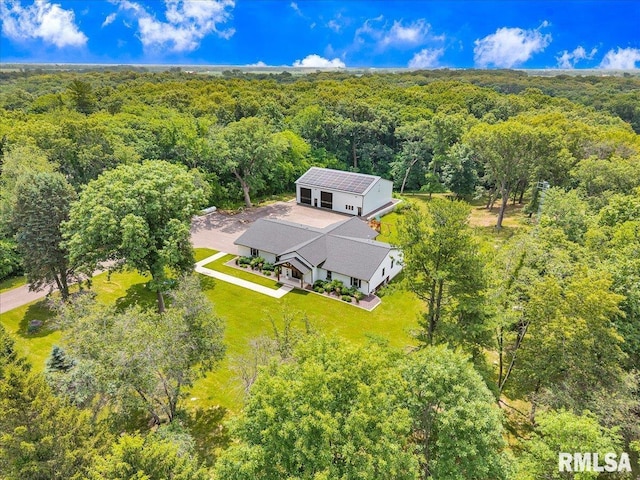 12804 W Dell Rd, Princeville, IL 61559 - aerial view of property and surrounding area with a heavily wooded area