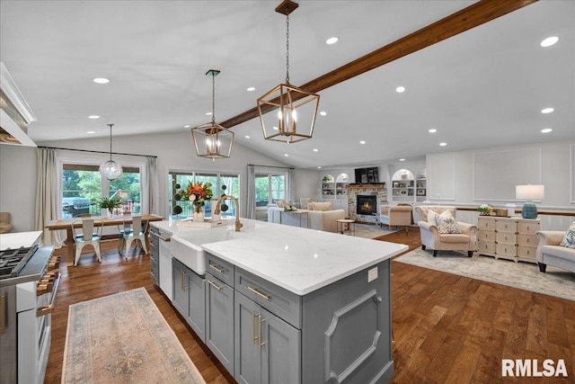 12804 W Dell Rd, Princeville, IL 61559 - kitchen with gray cabinets, high end stove, healthy amount of natural light, open floor plan, and recessed lighting