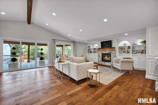 12804 W Dell Rd, Princeville, IL 61559 - living room with wood finished floors, a fireplace, recessed lighting, and built in shelves