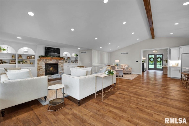 12804 W Dell Rd, Princeville, IL 61559 - living area featuring wood finished floors, a fireplace, recessed lighting, and built in shelves