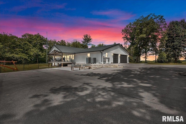 12804 W Dell Rd, Princeville, IL 61559 - view of front of house featuring a garage and driveway