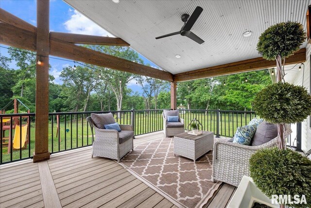 12804 W Dell Rd, Princeville, IL 61559 - wooden terrace featuring view of scattered trees, a ceiling fan, an outdoor living space, and a yard