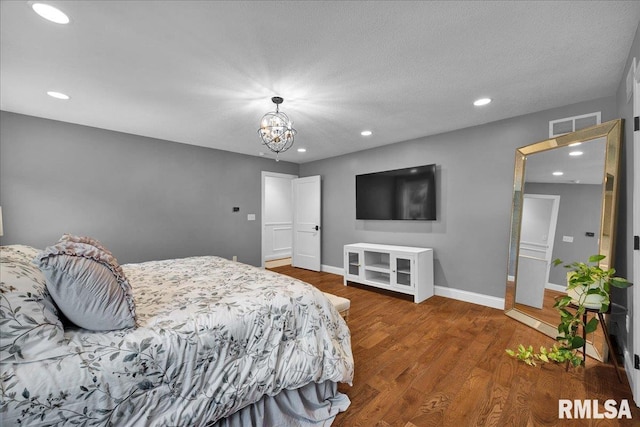 12804 W Dell Rd, Princeville, IL 61559 - bedroom featuring wood finished floors, recessed lighting, and a chandelier