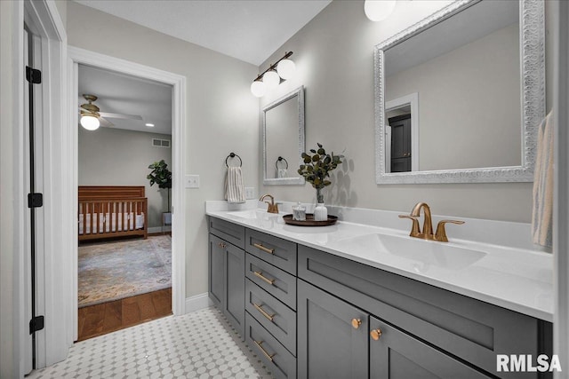 12804 W Dell Rd, Princeville, IL 61559 - bathroom with double vanity, a ceiling fan, and tile patterned floors