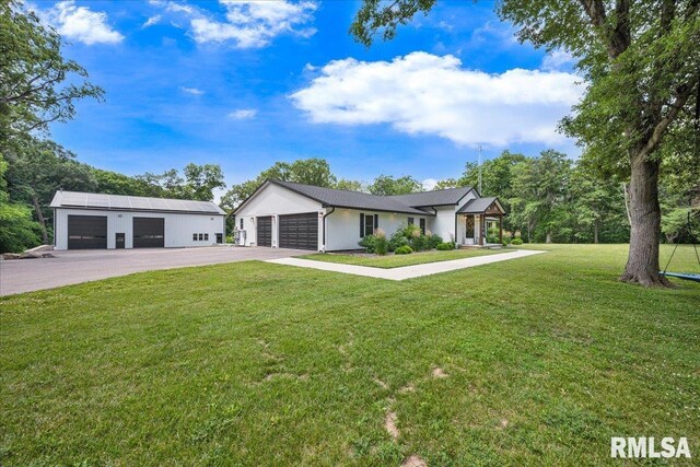 12804 W Dell Rd, Princeville, IL 61559 - view of front of home with a front yard and a detached garage