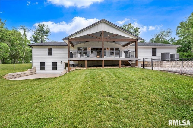 12804 W Dell Rd, Princeville, IL 61559 - rear view of house featuring a wooden deck and a patio