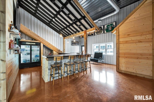 12804 W Dell Rd, Princeville, IL 61559 - kitchen featuring finished concrete flooring and wood walls
