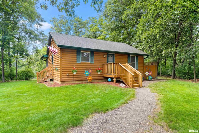 175 Lakecrest Pl, Dahinda, IL 61488 - rustic home with a front lawn, log veneer siding, and roof with shingles