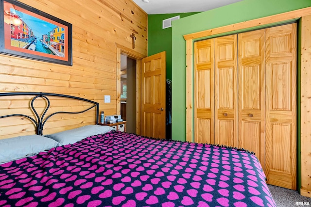 175 Lakecrest Pl, Dahinda, IL 61488 - bedroom with carpet flooring, wood walls, and a closet