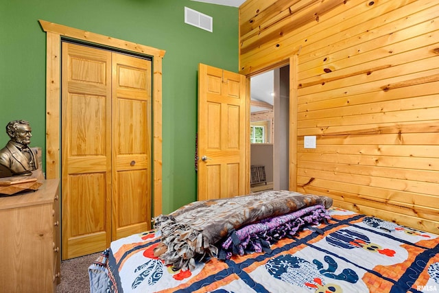 175 Lakecrest Pl, Dahinda, IL 61488 - bedroom with wood walls, a closet, and carpet