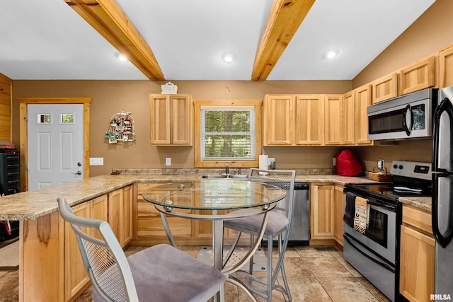 175 Lakecrest Pl, Dahinda, IL 61488 - kitchen featuring appliances with stainless steel finishes, light brown cabinetry, a peninsula, beam ceiling, and light countertops