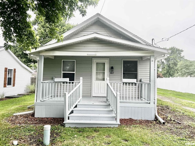 407 E Depot St, Knoxville, IL 61448 - shotgun-style home featuring covered porch