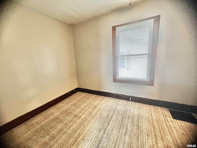 407 E Depot St, Knoxville, IL 61448 - unfurnished room with baseboards and carpet floors