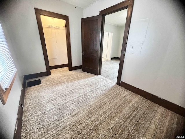 407 E Depot St, Knoxville, IL 61448 - unfurnished room featuring baseboards and light colored carpet