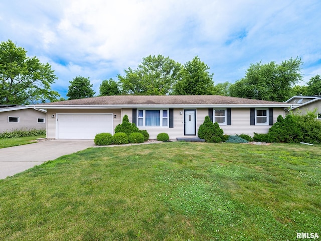 410 Stout Dr, Mackinaw, IL 61755 - ranch-style house with an attached garage, driveway, and a front lawn