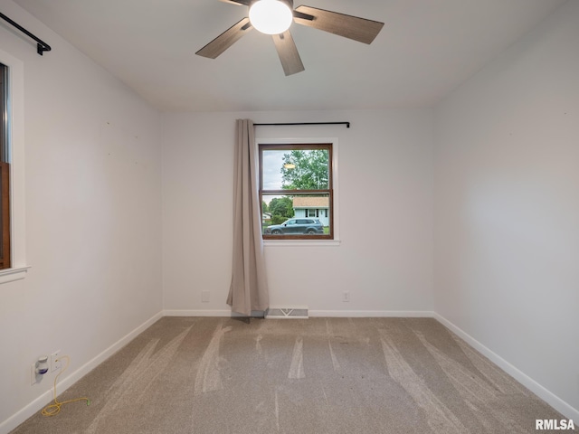 410 Stout Dr, Mackinaw, IL 61755 - empty room with carpet floors and a ceiling fan