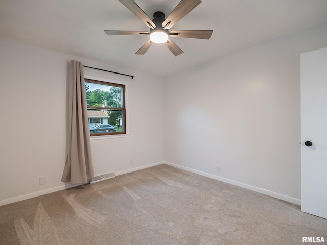 410 Stout Dr, Mackinaw, IL 61755 - spare room featuring ceiling fan and light carpet
